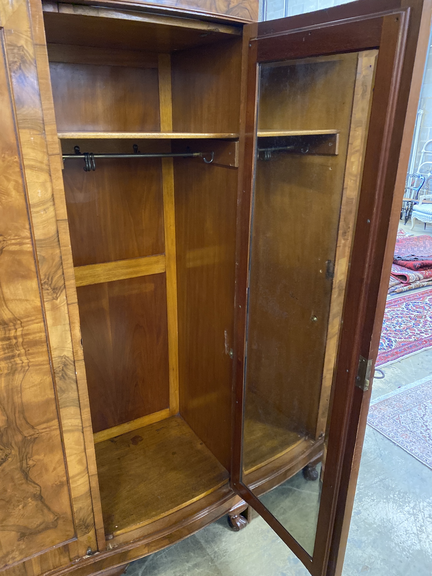 A Queen Anne revival figured walnut triple wardrobe, width 180cm, depth 56cm, height 205cm